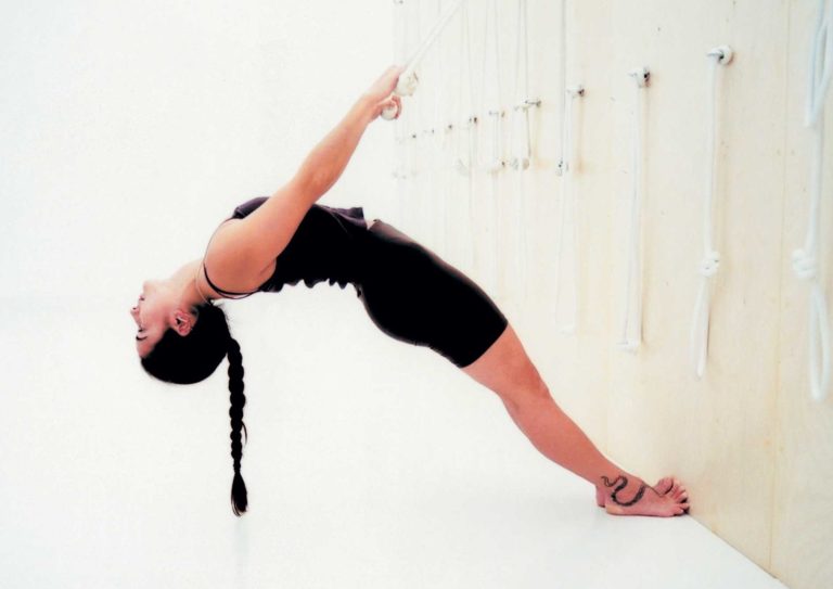 Iyengar yoga student on ropes