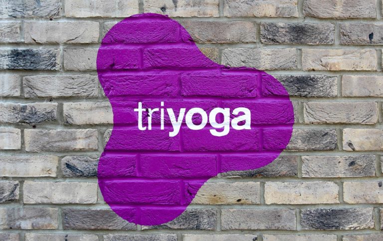 triyoga logo on wall in Ealing
