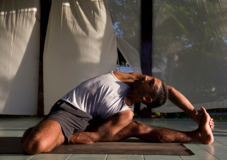man doing seated yoga posture Bob Bharji triyoga charity yoga workshop