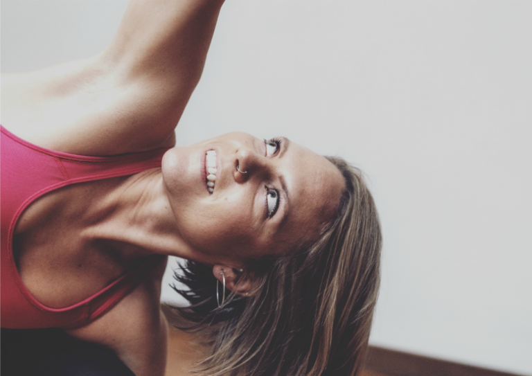 close up image of woman practising yoga, Lauren Munday stress blog triyoga