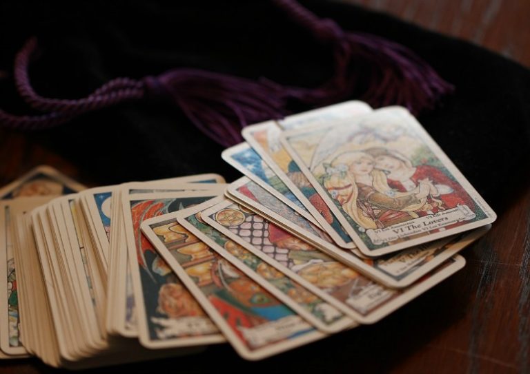 tarot readings, tarot cards laying across table