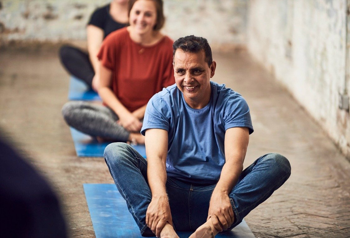 OURMALA yoga for refugees and asylum-seekers new class at triyoga soho man seated doing yoga