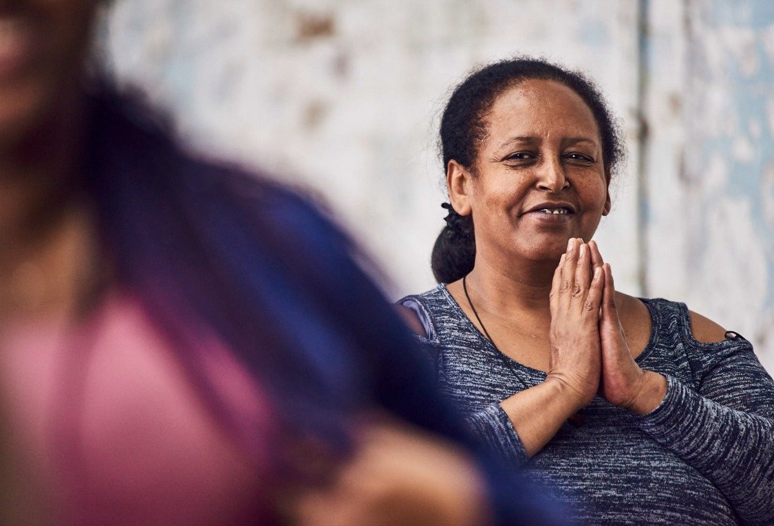 OURMALA female yoga student for refugees and asylum-seekers new class at triyoga Soho