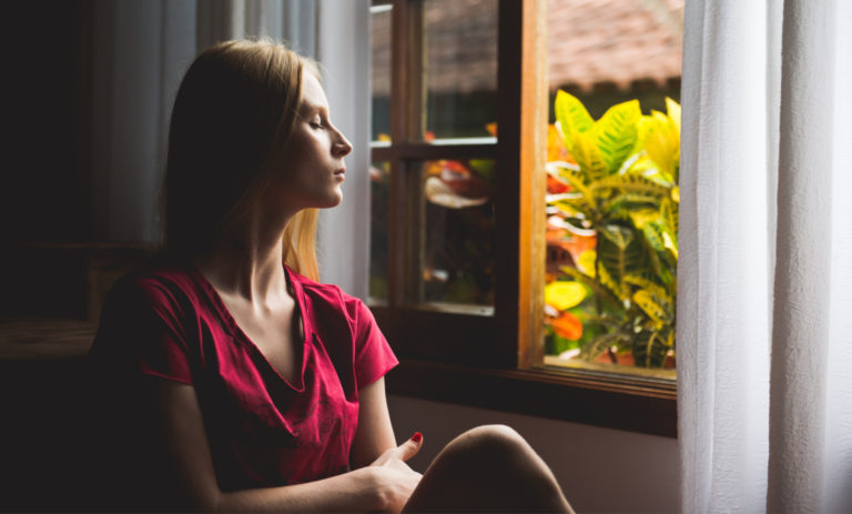 therapy focus, bodytalk at triyoga woman closed eyes gazing through window