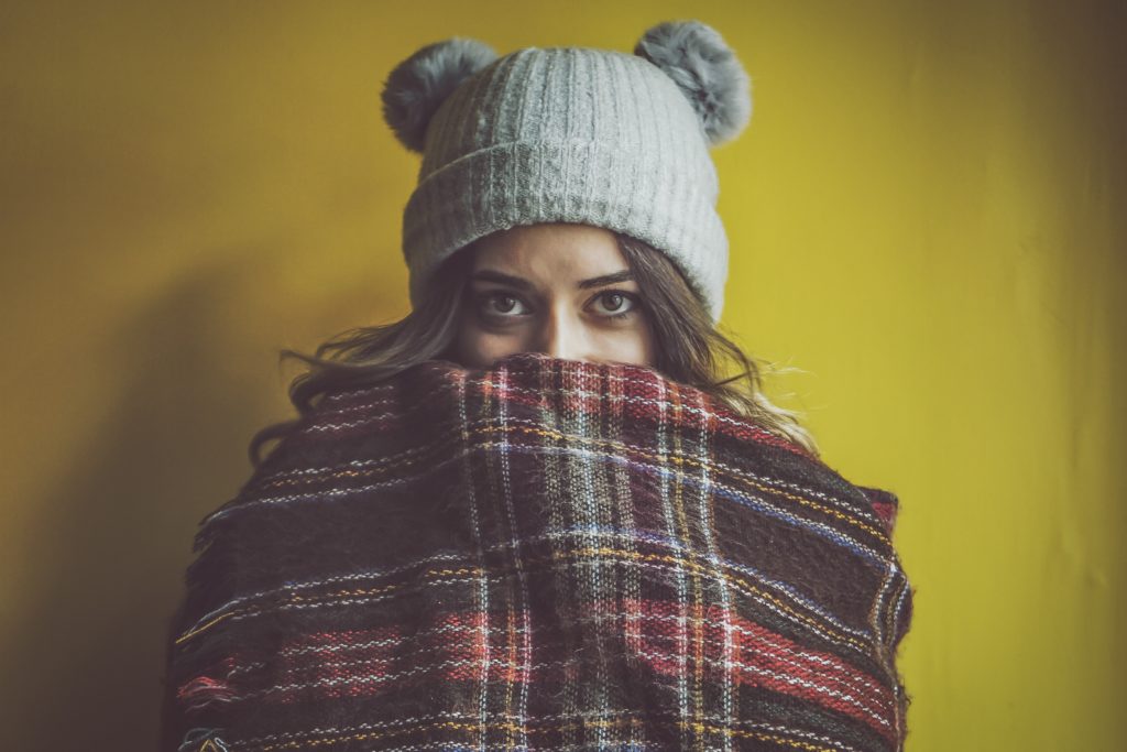womans wearing scarf and winter hat