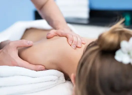 Image of a woman receiving a post-natal massage at Triyoga in London