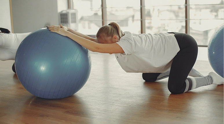 Woman exercising with a stability ball