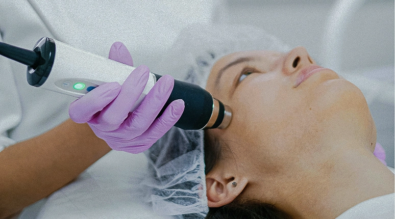 Facial treatment with a device