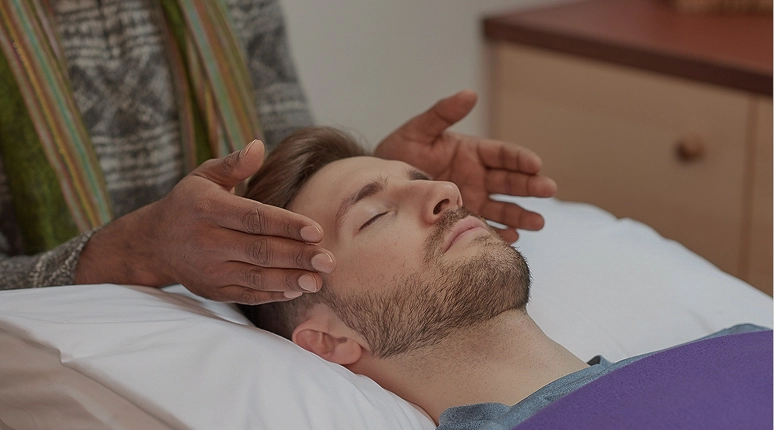 Person receiving a healing treatment
