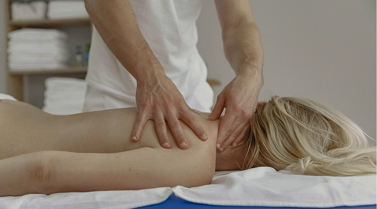 Person receiving a therapeutic massage.