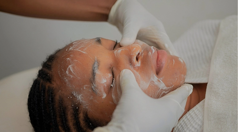 Person receiving a facial treatment.