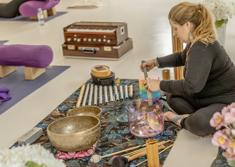 Woman preparing for sound bath session