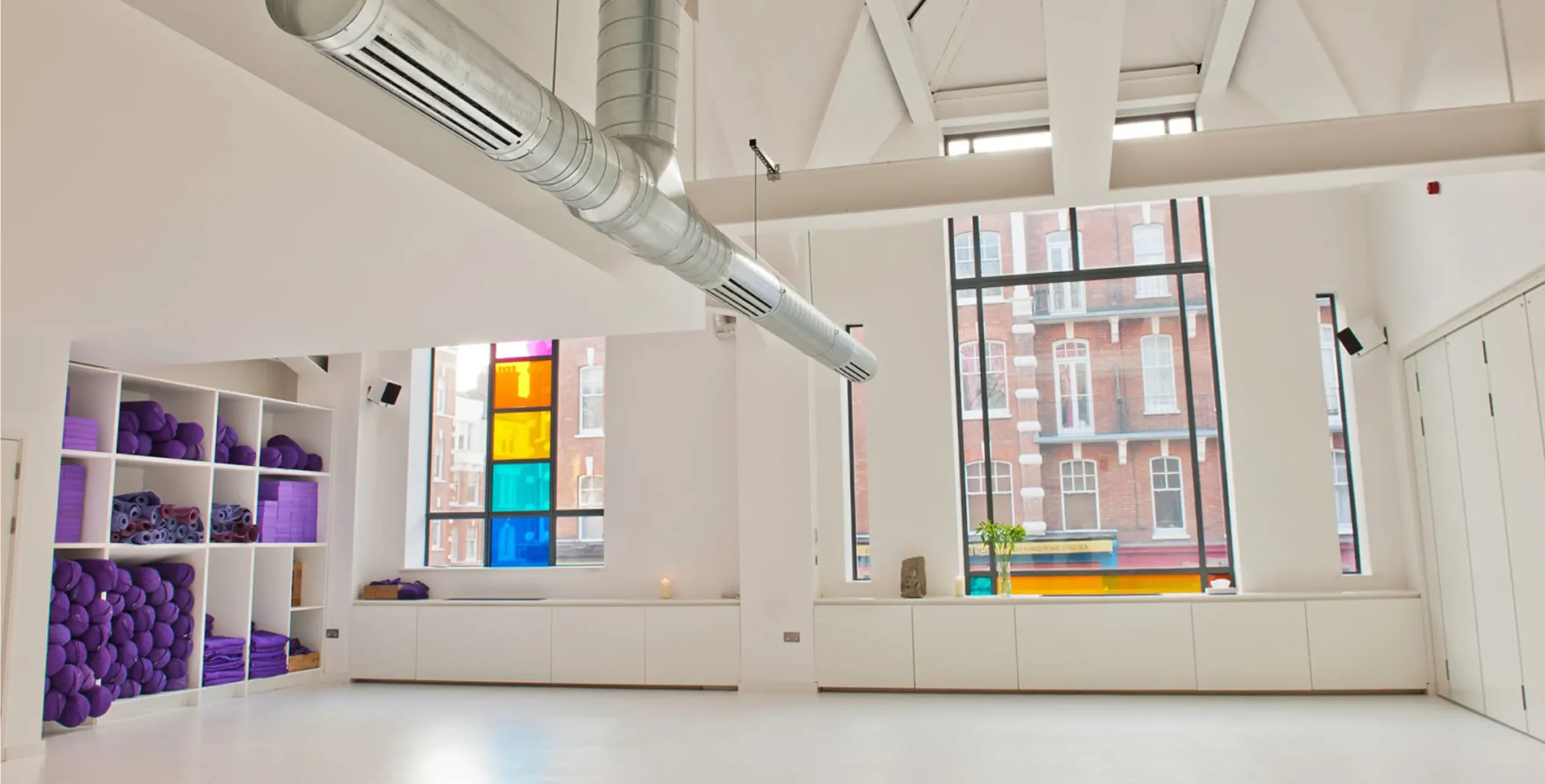 Bright, spacious yoga studio interior.